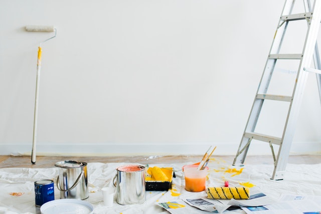 Painting and ladder in living room of new property