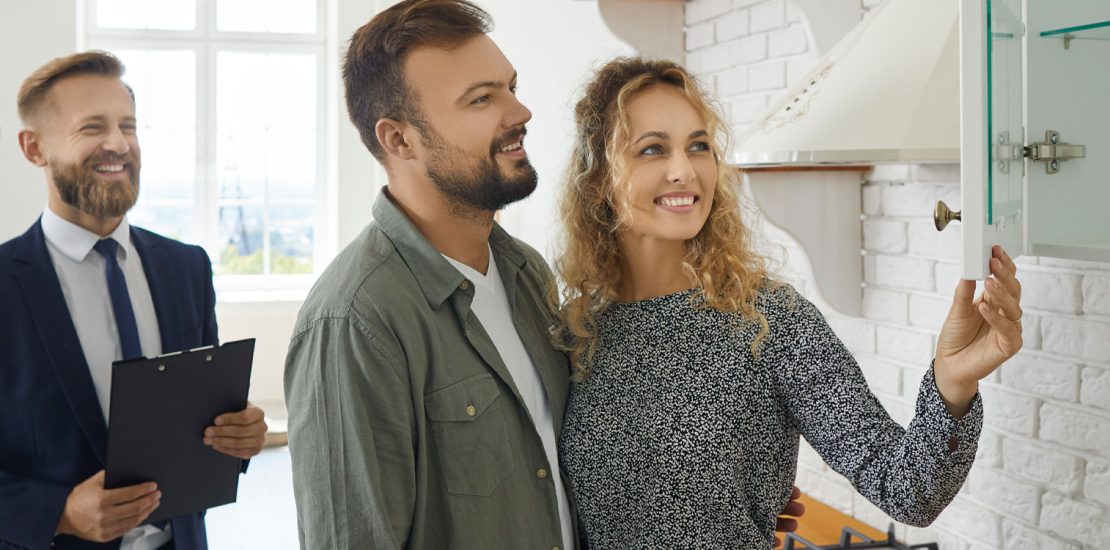 Couple visiting a new house with real estate manager