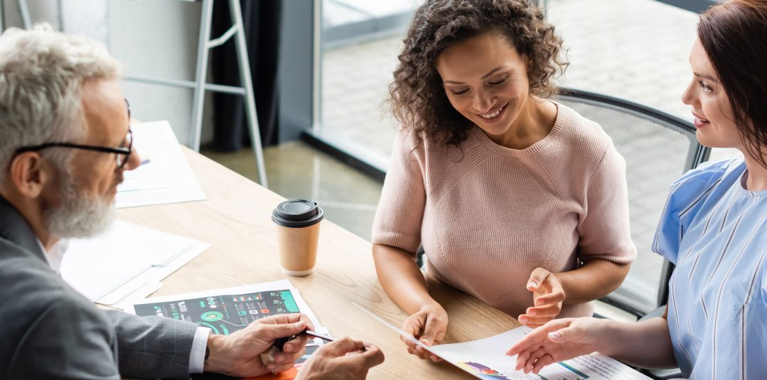 2 women sitting with a financial advisor