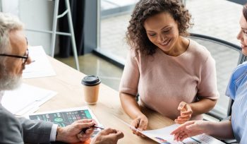 2 women sitting with a financial advisor