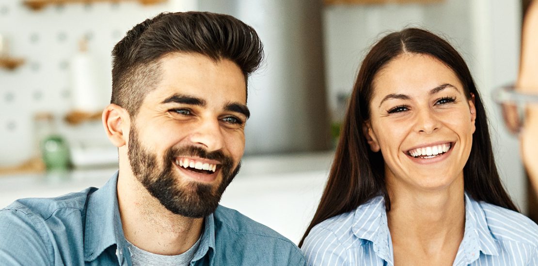 Couple discussing home settlement with mortgage broker