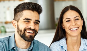 Couple discussing home settlement with mortgage broker