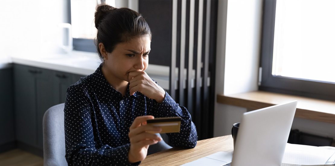 worried person in front of laptop