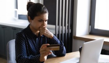 worried person in front of laptop