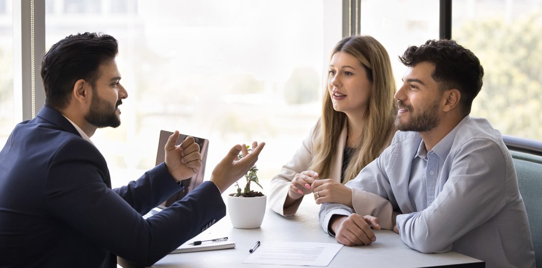 couple discussing choosing a property