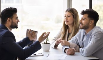 couple discussing choosing a property