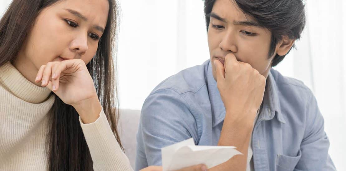couple thinking around a table