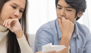 couple thinking around a table